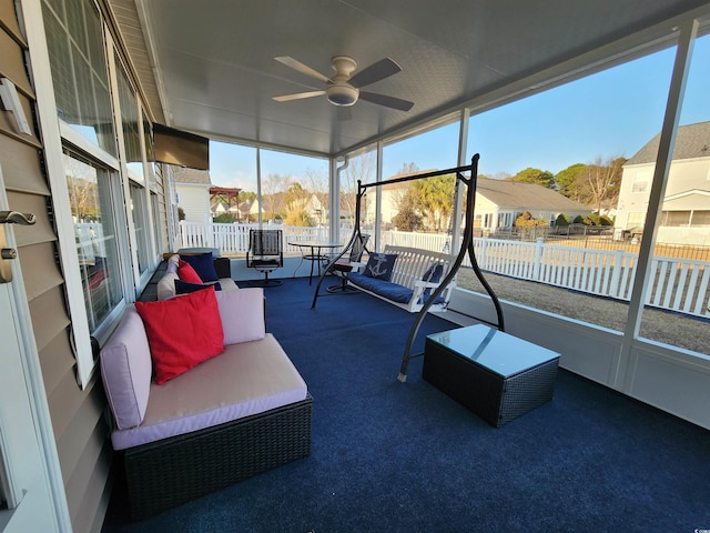 sunroom with ceiling fan