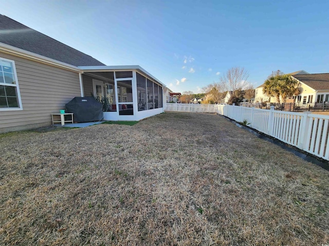 view of yard featuring a sunroom