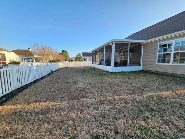 view of yard with a sunroom