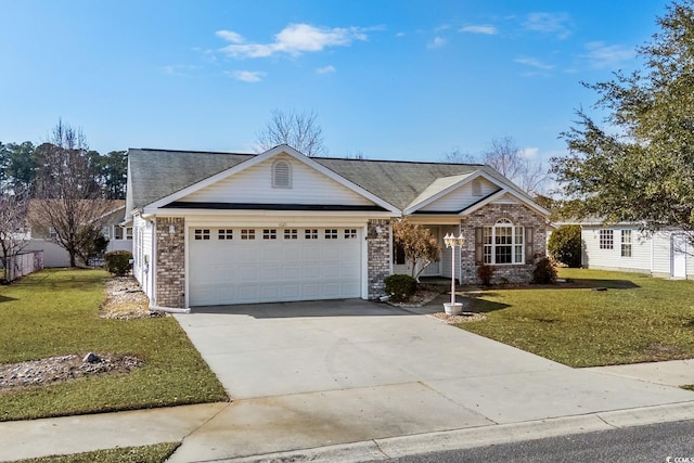 view of front of house with an attached garage, concrete driveway, brick siding, and a front yard