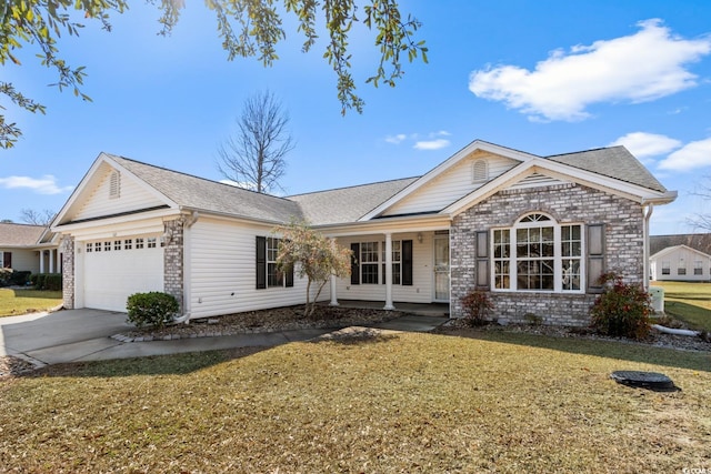 view of front facade with brick siding, roof with shingles, concrete driveway, a front yard, and a garage