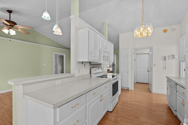 kitchen featuring lofted ceiling, light countertops, light wood-style floors, white cabinetry, and white appliances