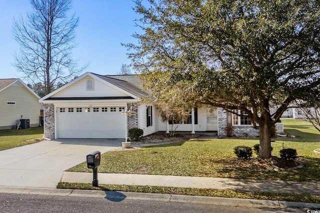 view of front of property featuring brick siding, an attached garage, cooling unit, driveway, and a front lawn