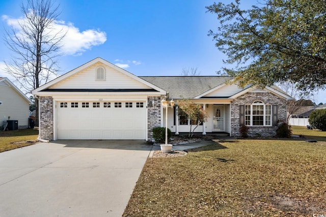 single story home featuring a garage, central AC, brick siding, driveway, and a front yard