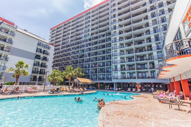 view of swimming pool featuring a patio area