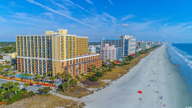 drone / aerial view with a water view and a view of the beach