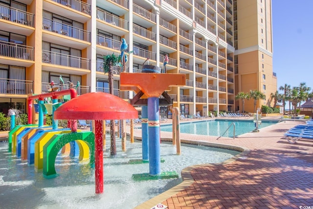 view of swimming pool with a patio