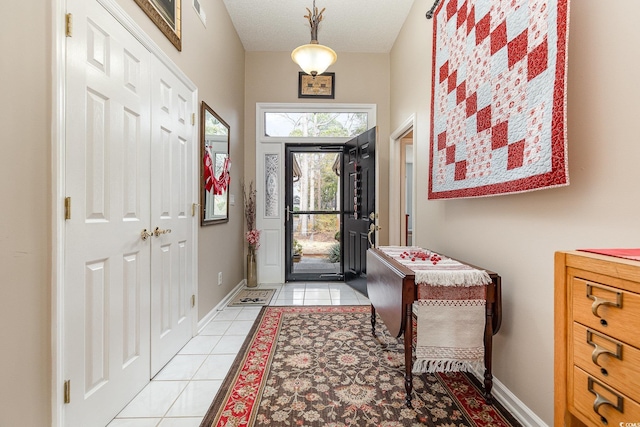 foyer entrance featuring light tile patterned floors