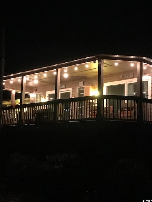 view of back house at night