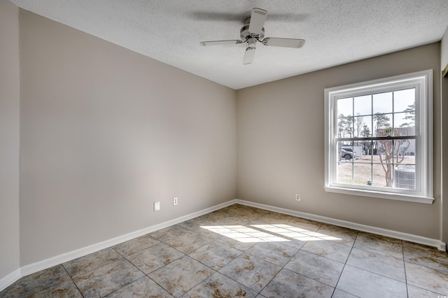 2151 Clearwater Dr Unit C, Surfside Beach, SC 29575 - spare room featuring tile patterned floors, a textured ceiling, baseboards, and a ceiling fan