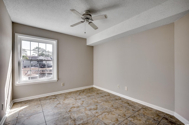2151 Clearwater Dr Unit C, Surfside Beach, SC 29575 - empty room with ceiling fan, a textured ceiling, tile patterned flooring, and baseboards