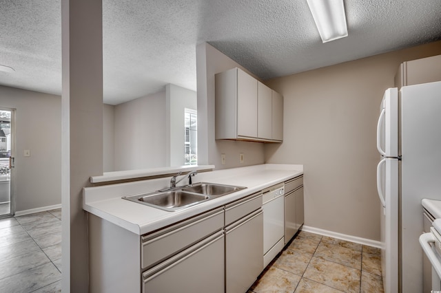 2151 Clearwater Dr Unit C, Surfside Beach, SC 29575 - kitchen with a sink, healthy amount of natural light, white appliances, a textured ceiling, and light countertops
