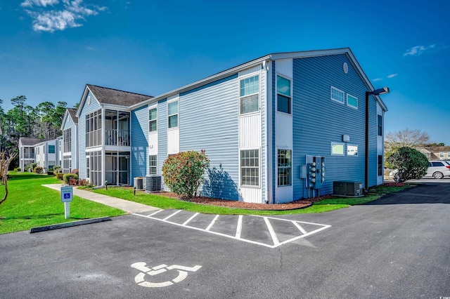 2151 Clearwater Dr Unit C, Surfside Beach, SC 29575 - view of property featuring central air condition unit and uncovered parking