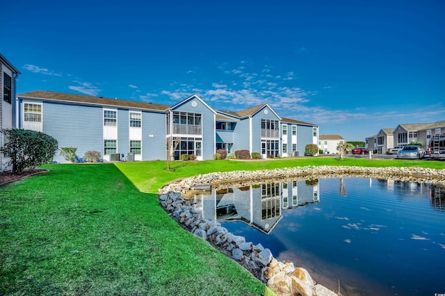 2151 Clearwater Dr Unit C, Surfside Beach, SC 29575 - rear view of property with a water view and a lawn