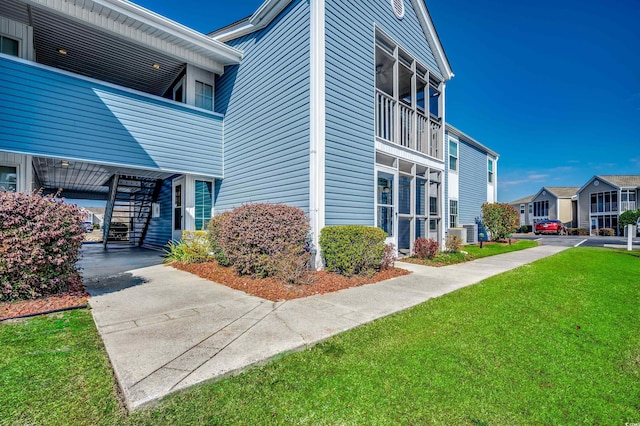 2151 Clearwater Dr Unit C, Surfside Beach, SC 29575 - view of building exterior with stairway and a residential view