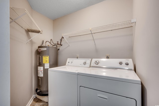 2151 Clearwater Dr Unit C, Surfside Beach, SC 29575 - clothes washing area with water heater, washer and dryer, and baseboards