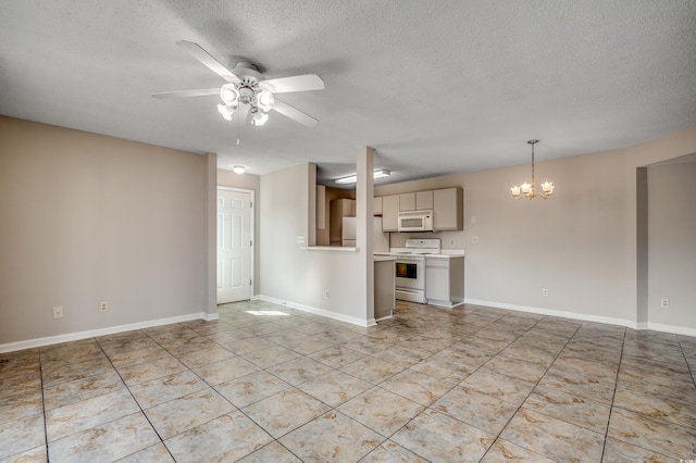 2151 Clearwater Dr Unit C, Surfside Beach, SC 29575 - unfurnished living room with a chandelier, ceiling fan, light tile patterned floors, a textured ceiling, and baseboards