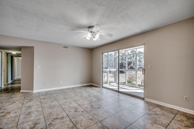 2151 Clearwater Dr Unit C, Surfside Beach, SC 29575 - spare room featuring ceiling fan, light tile patterned floors, a textured ceiling, and baseboards