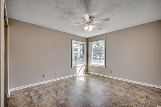 2151 Clearwater Dr Unit C, Surfside Beach, SC 29575 - tiled spare room with a textured ceiling, ceiling fan, and baseboards