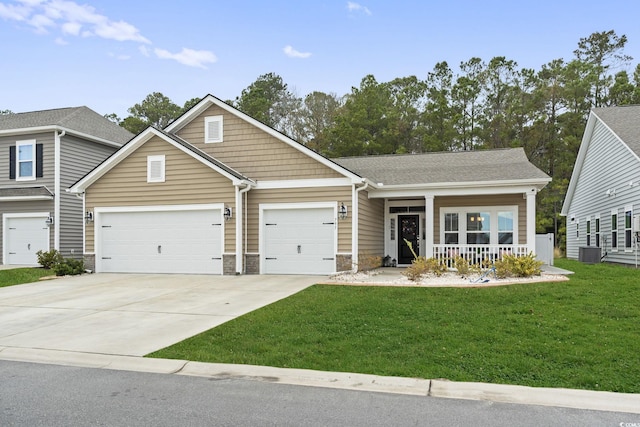 view of front of home featuring central AC unit, covered porch, and a front yard