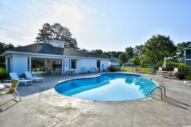 view of swimming pool with a patio area