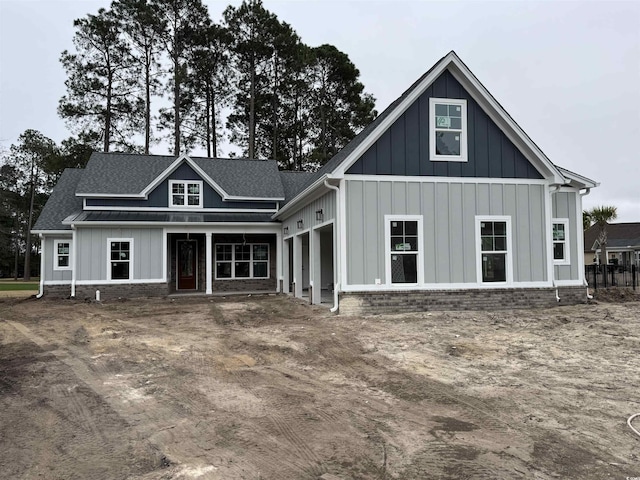 rear view of property featuring a garage