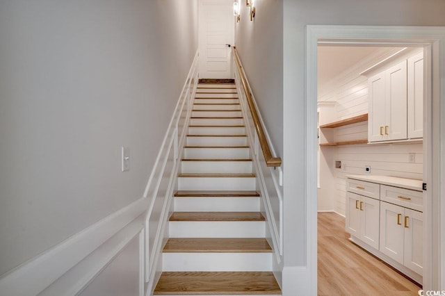 stairs with wood finished floors