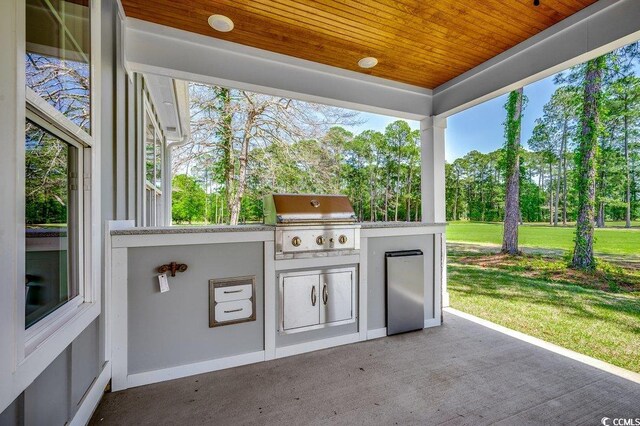 view of patio / terrace with exterior kitchen and area for grilling
