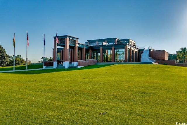 rear view of property with a yard