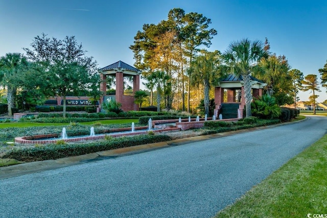 view of front of house with a gazebo, a standing seam roof, and metal roof