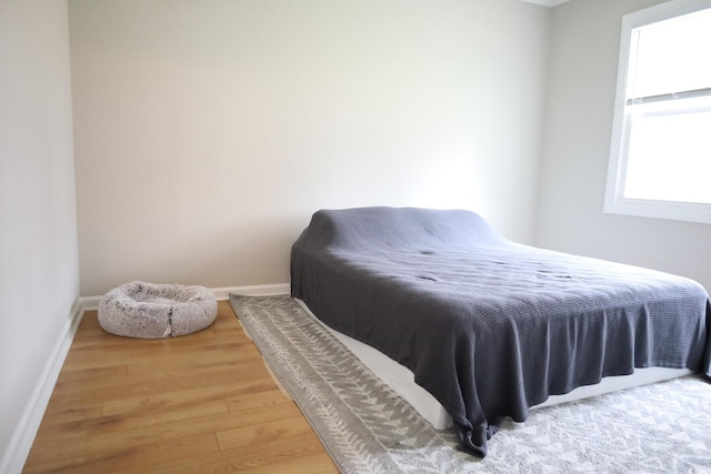 bedroom with wood-type flooring