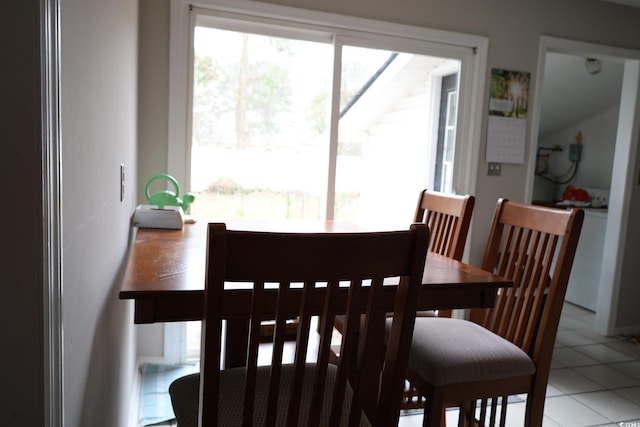 dining room featuring light tile patterned floors and plenty of natural light