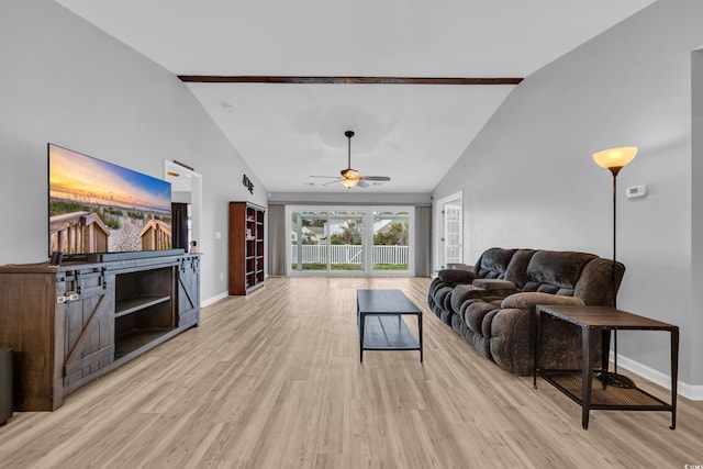 living room with light wood-type flooring, high vaulted ceiling, and ceiling fan