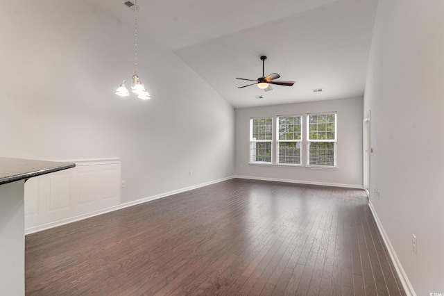 156 Parmelee Dr Unit B, Murrells Inlet, SC 29576 - unfurnished living room with vaulted ceiling, dark wood-style flooring, ceiling fan, a chandelier, and baseboards