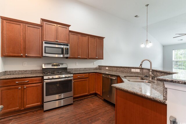 156 Parmelee Dr Unit B, Murrells Inlet, SC 29576 - kitchen featuring appliances with stainless steel finishes, a sink, lofted ceiling, dark stone countertops, and dark wood finished floors