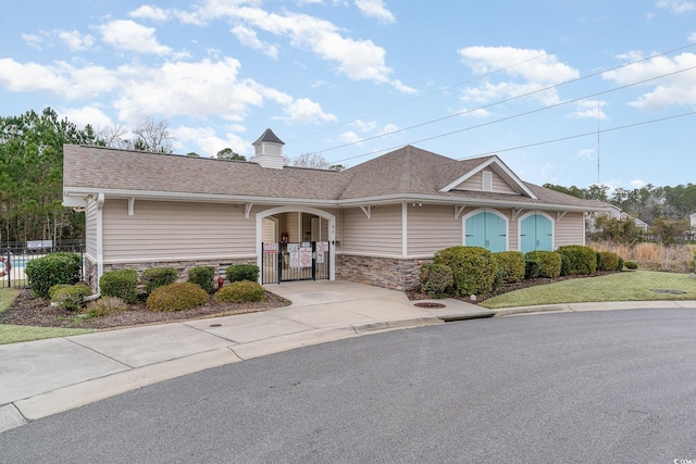 156 Parmelee Dr Unit B, Murrells Inlet, SC 29576 - ranch-style house with stone siding, a gate, and roof with shingles