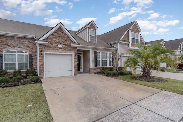 156 Parmelee Dr Unit B, Murrells Inlet, SC 29576 - view of front facade featuring stone siding, driveway, an attached garage, a front lawn, and roof with shingles
