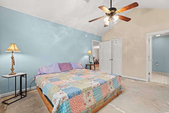 bedroom featuring ceiling fan, vaulted ceiling, and concrete floors