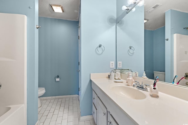 full bathroom featuring vanity, toilet, independent shower and bath, and a textured ceiling