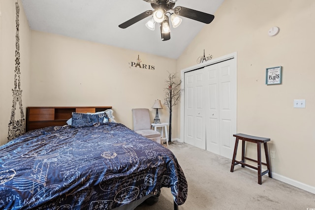 carpeted bedroom featuring vaulted ceiling, ceiling fan, and a closet