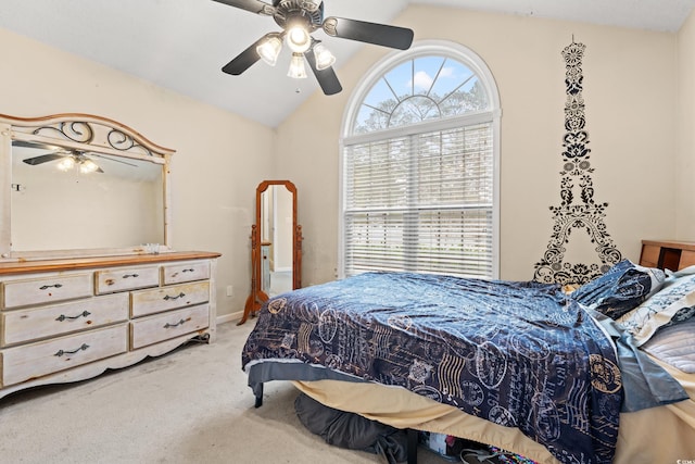 bedroom featuring ceiling fan, carpet flooring, and vaulted ceiling