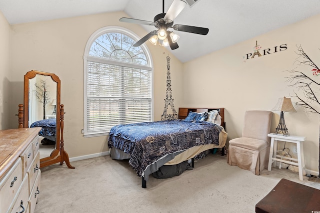 carpeted bedroom with multiple windows, vaulted ceiling, and ceiling fan