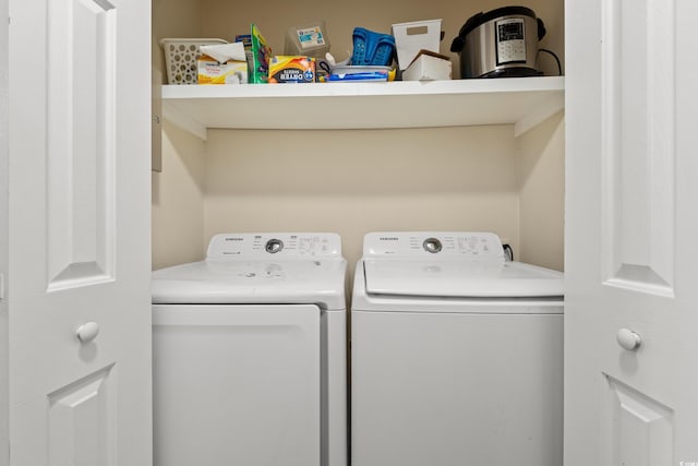 laundry area with washing machine and clothes dryer