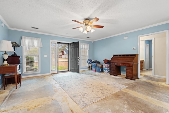 misc room with ceiling fan, ornamental molding, and a textured ceiling