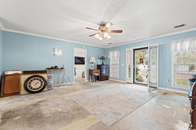 interior space featuring ceiling fan, ornamental molding, and a textured ceiling