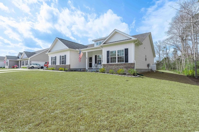 view of front of home with a front lawn and covered porch