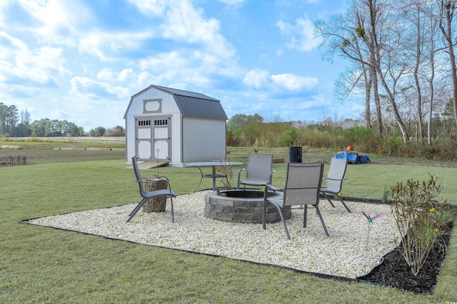 view of patio / terrace featuring a storage unit and a fire pit