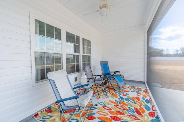 sunroom / solarium with ceiling fan