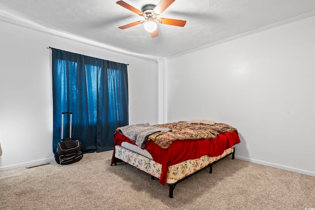 carpeted bedroom with crown molding, visible vents, ceiling fan, a textured ceiling, and baseboards