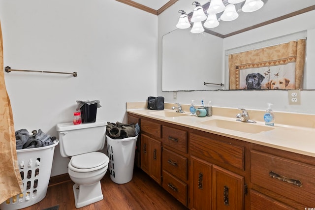 full bath with toilet, crown molding, a sink, and wood finished floors